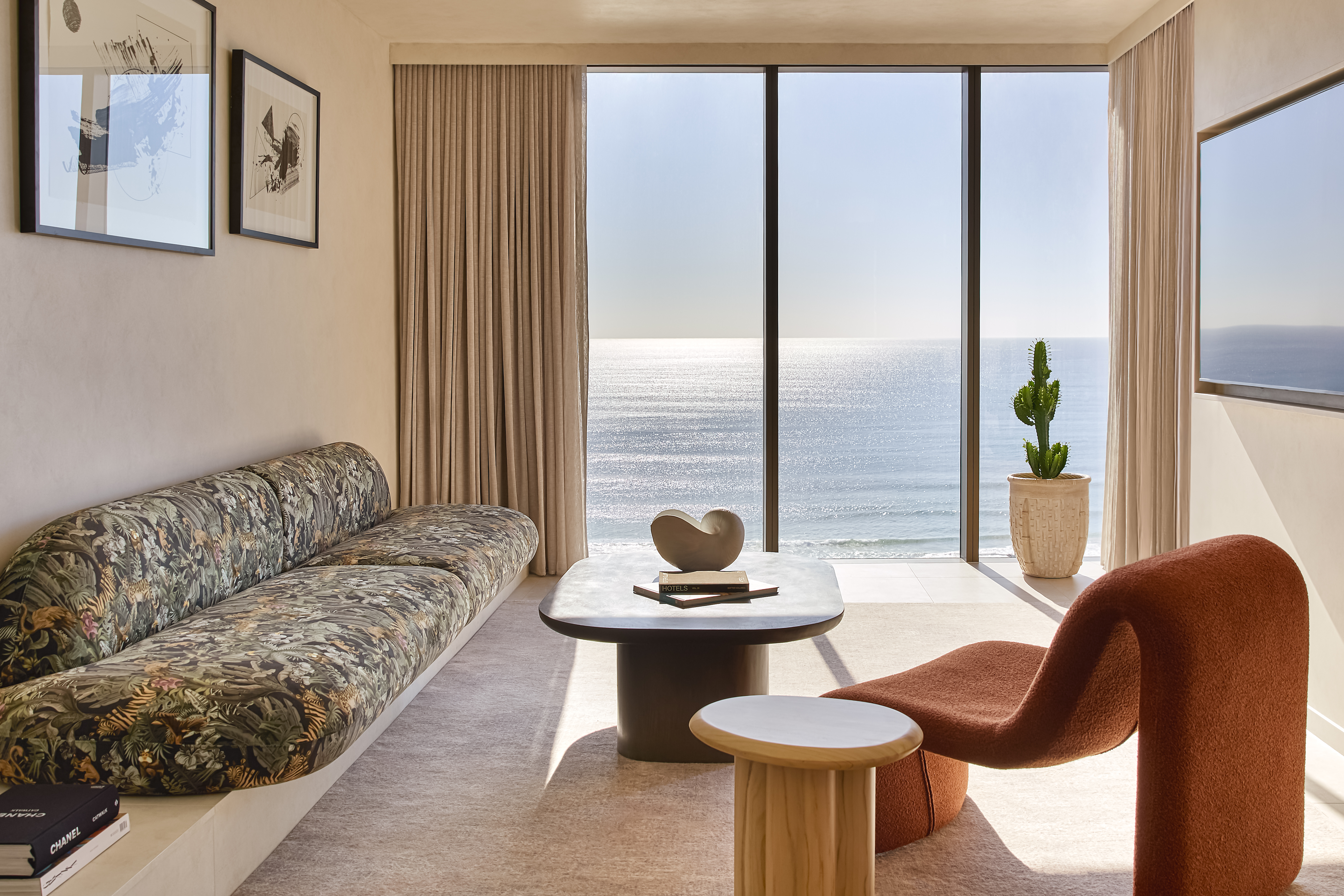 Ocean suite living area with floor-to-ceiling glass